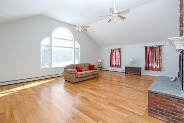 living room with baseboard heating, vaulted ceiling, and hardwood / wood-style floors