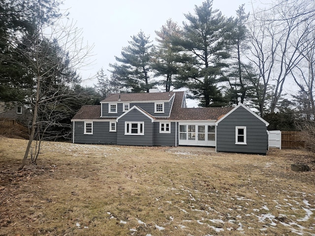 rear view of house with a lawn