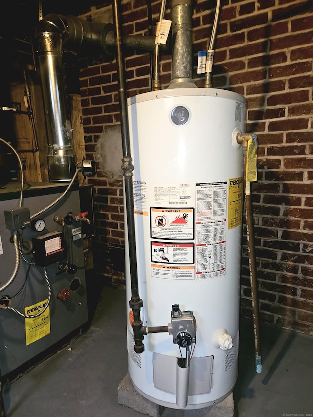 utility room with gas water heater