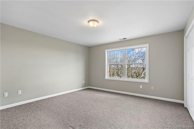 empty room with carpet flooring