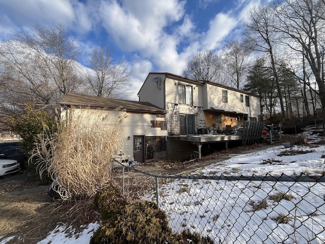 view of snow covered house