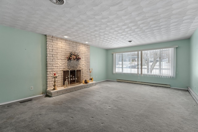 unfurnished living room featuring a baseboard heating unit, a textured ceiling, a brick fireplace, and carpet