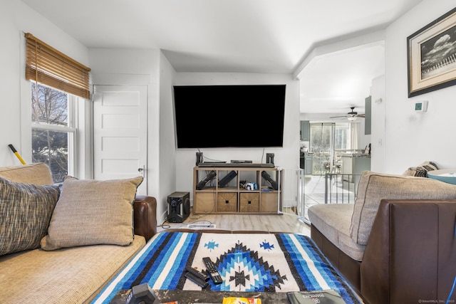 living room with ceiling fan and light hardwood / wood-style floors