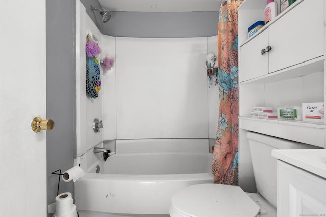 full bathroom featuring shower / bath combo, vanity, and toilet