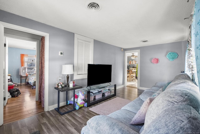 living room with dark wood-type flooring