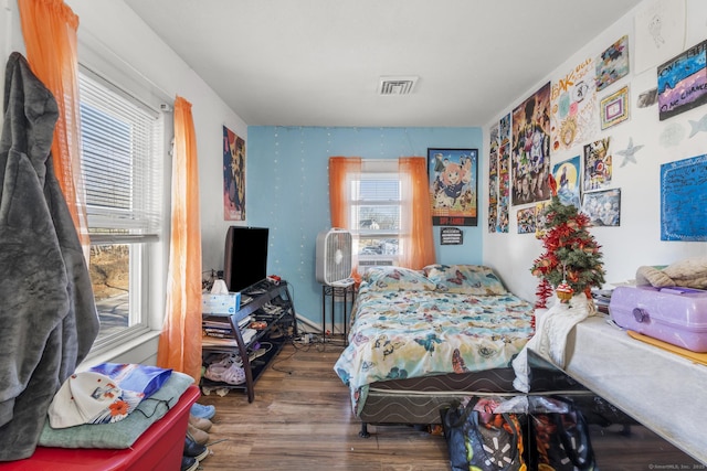 bedroom with hardwood / wood-style floors