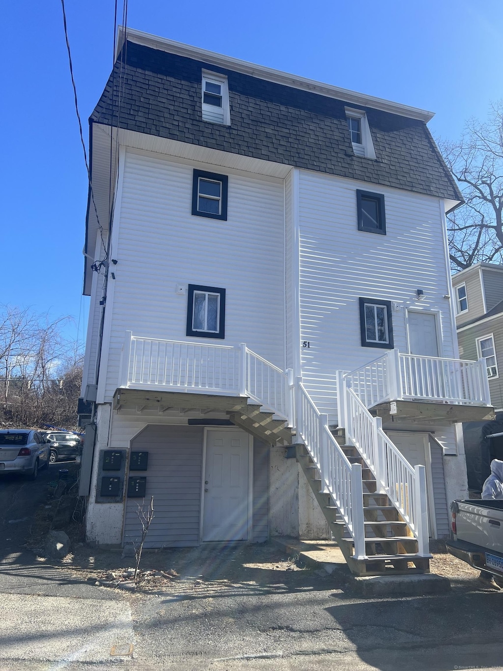 rear view of house featuring a garage