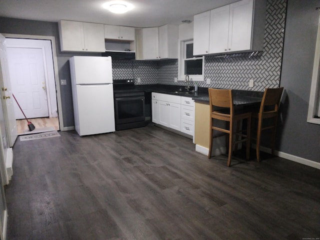 kitchen featuring white cabinetry, sink, decorative backsplash, white refrigerator, and black / electric stove