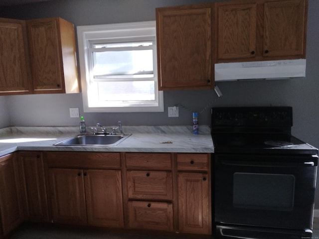 kitchen featuring sink and black / electric stove