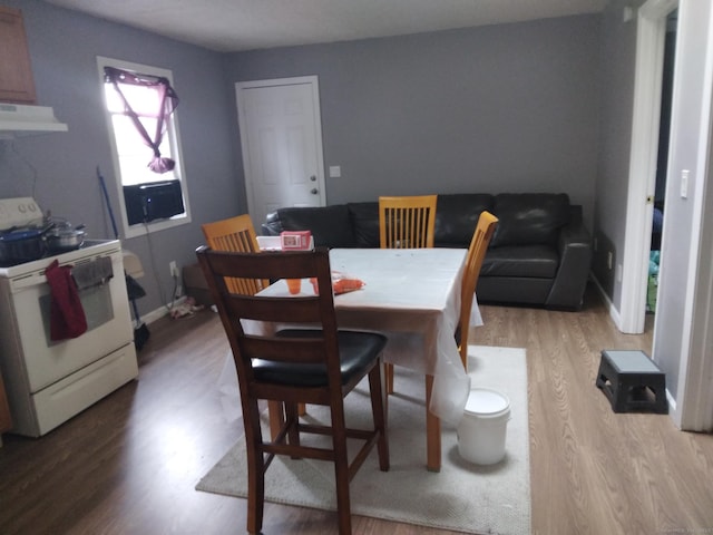 dining area featuring light wood-type flooring