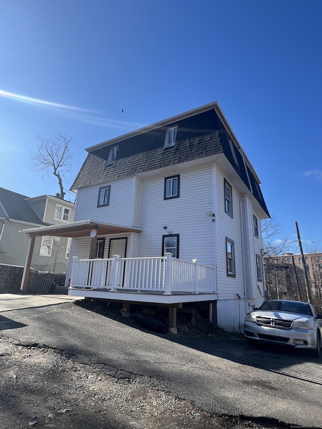 rear view of property with a deck