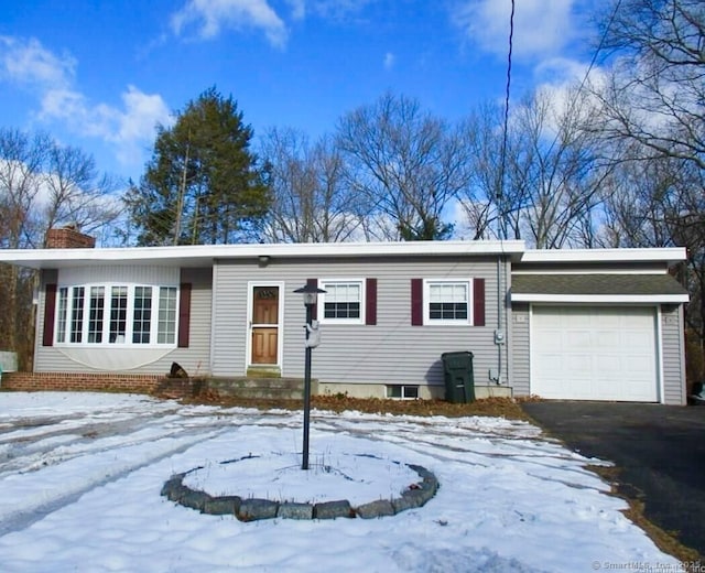 single story home featuring a garage