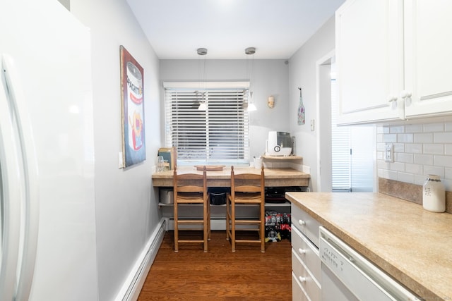 kitchen featuring white dishwasher, hanging light fixtures, decorative backsplash, and white cabinetry