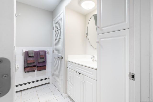 bathroom featuring a baseboard radiator, tile patterned floors, and vanity