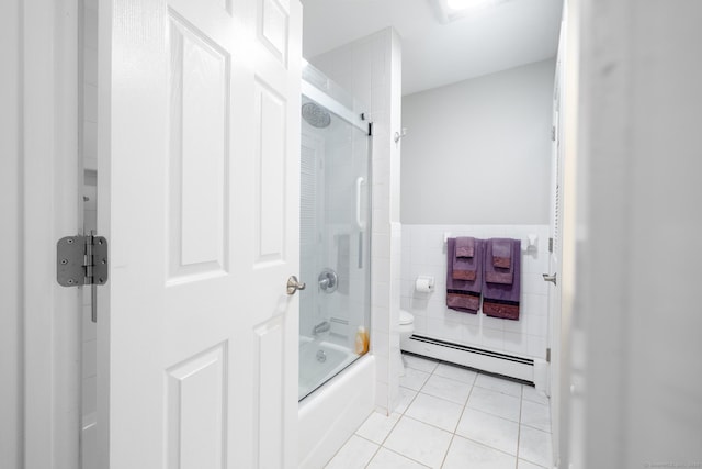 bathroom featuring shower / bath combination with glass door, tile patterned floors, baseboard heating, and toilet