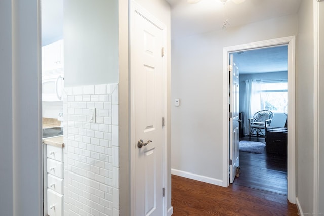 hall with dark wood-type flooring