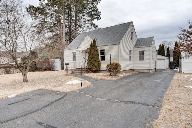 view of front facade with an outbuilding and a garage