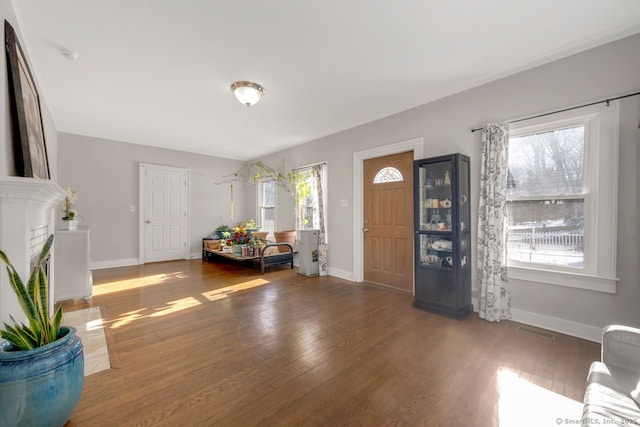 entryway with hardwood / wood-style floors