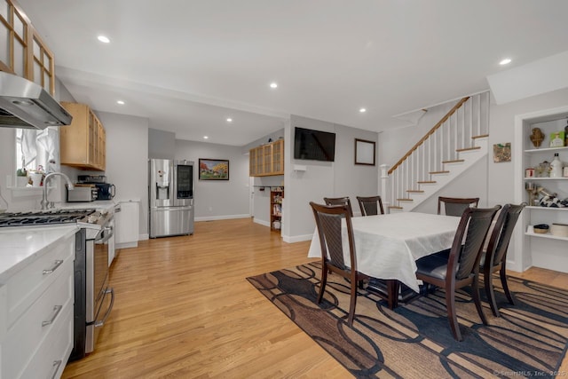 dining area featuring light wood-type flooring