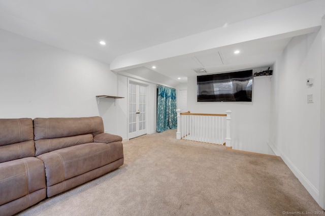 carpeted living room with french doors