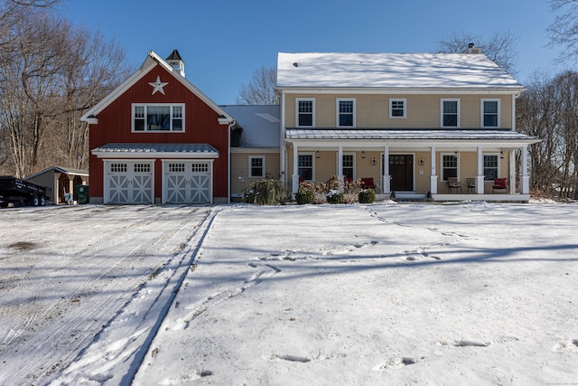 view of front of house with a garage and covered porch