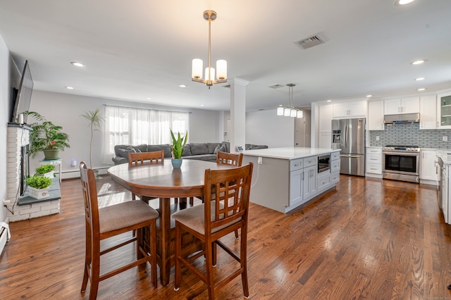 dining space featuring dark wood-type flooring