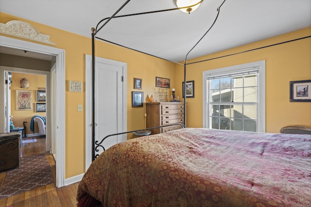 bedroom with hardwood / wood-style flooring