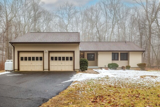 ranch-style home featuring a garage