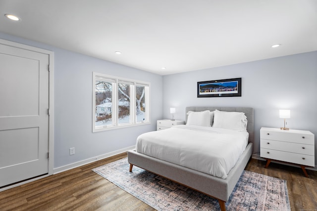 bedroom featuring dark hardwood / wood-style flooring