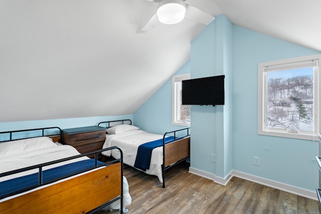 bedroom featuring lofted ceiling, hardwood / wood-style flooring, and ceiling fan