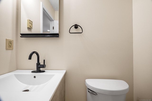 bathroom featuring sink and toilet