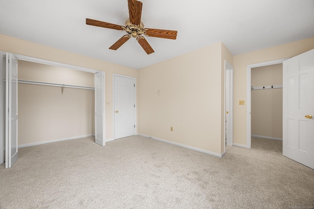 unfurnished bedroom featuring light colored carpet and ceiling fan