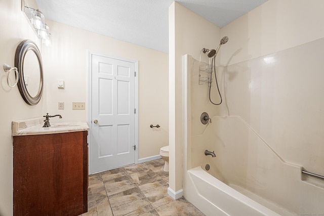 full bathroom with toilet, vanity, and  shower combination