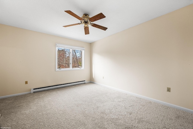 carpeted spare room featuring a baseboard heating unit and ceiling fan