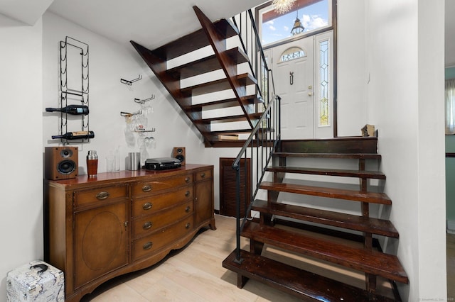 stairway featuring hardwood / wood-style flooring