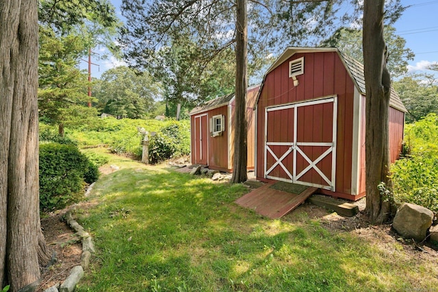 view of outdoor structure with a lawn