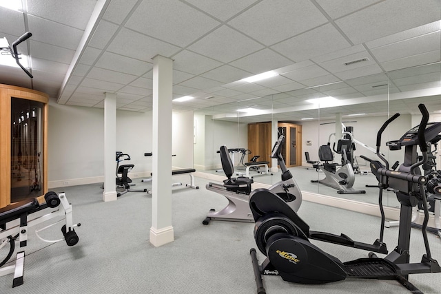 exercise room featuring a drop ceiling