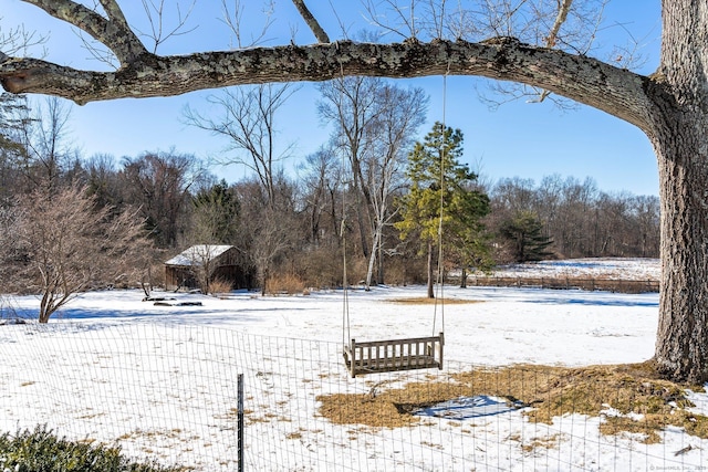 view of yard layered in snow