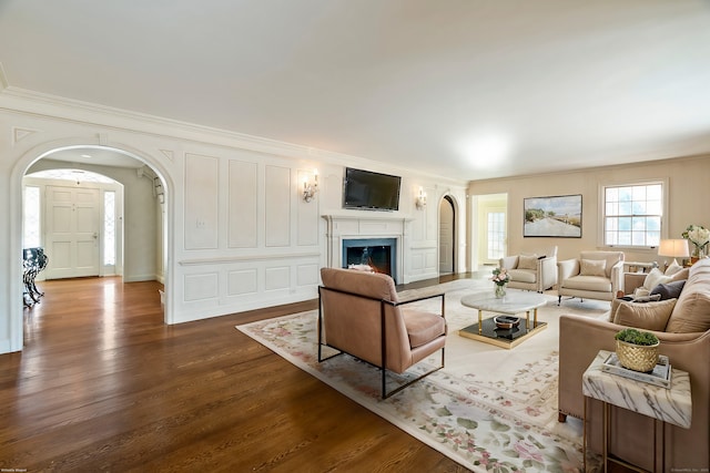 living room featuring crown molding and hardwood / wood-style floors