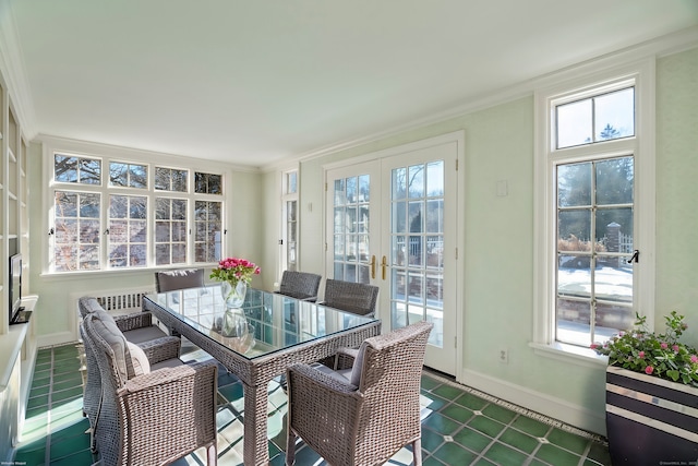 dining room with french doors and ornamental molding