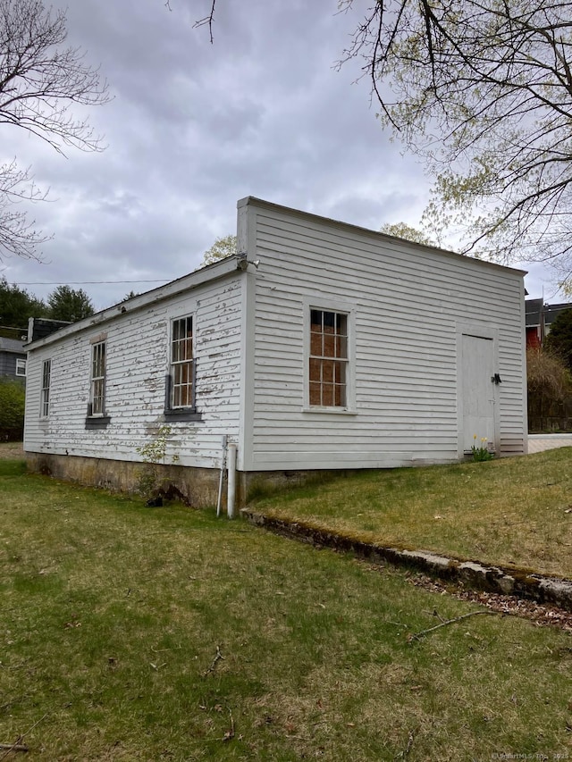view of home's exterior featuring a lawn