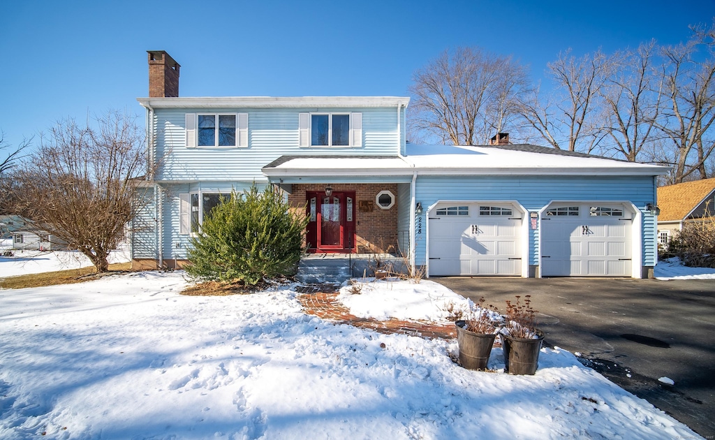 front of property with a garage