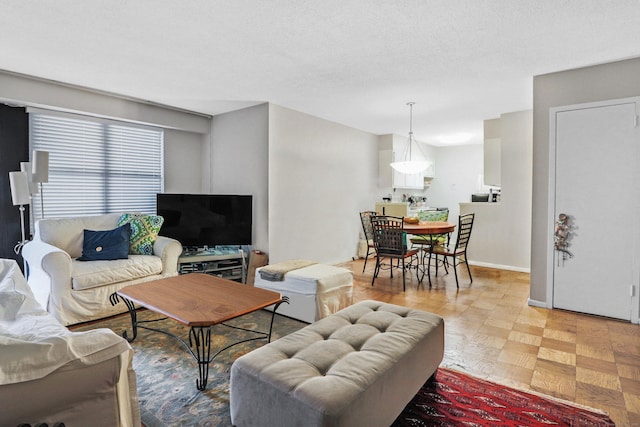 living room with a textured ceiling