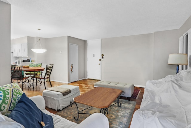 living room featuring a textured ceiling