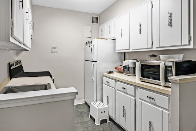 kitchen with white cabinetry, appliances with stainless steel finishes, and sink