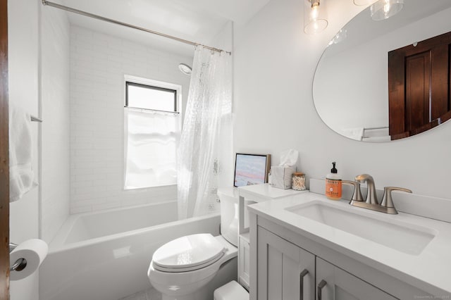 full bathroom with vanity, shower / bath combination with curtain, and toilet