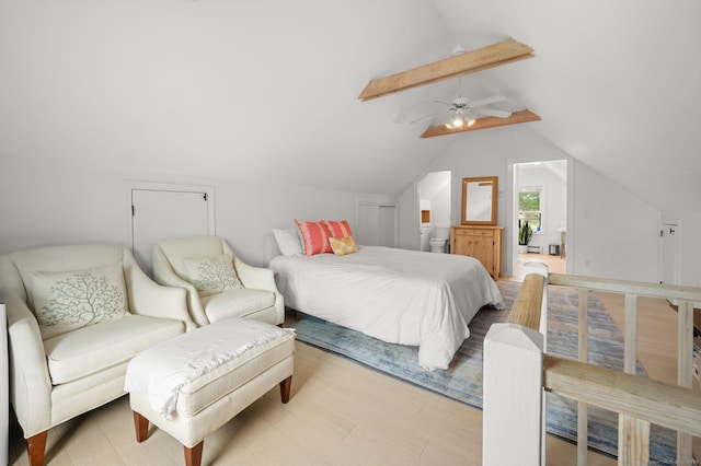 bedroom with lofted ceiling with beams, ceiling fan, and light hardwood / wood-style floors