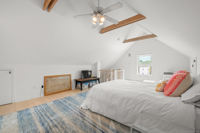 bedroom featuring vaulted ceiling with beams, ceiling fan, and light wood-type flooring