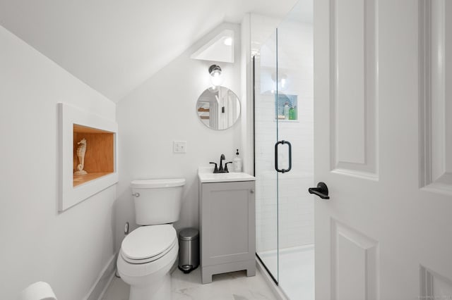 bathroom with vanity, lofted ceiling, an enclosed shower, and toilet