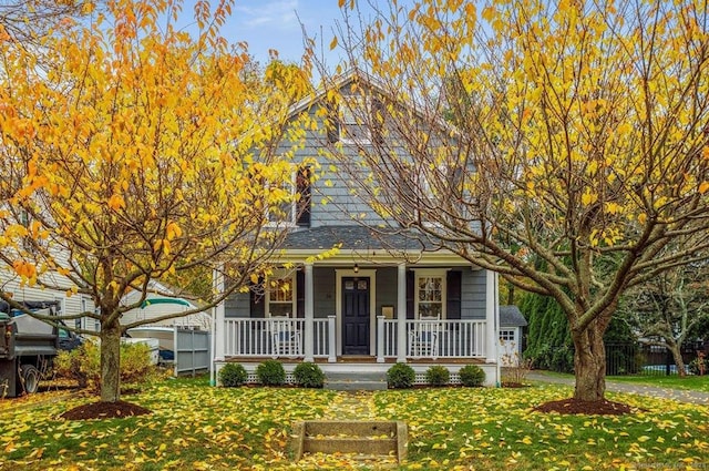 obstructed view of property featuring a front lawn and a porch